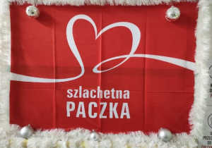 Na zdjęciu widnieje logo akcji charytatywnej „Szlachetna paczka”.